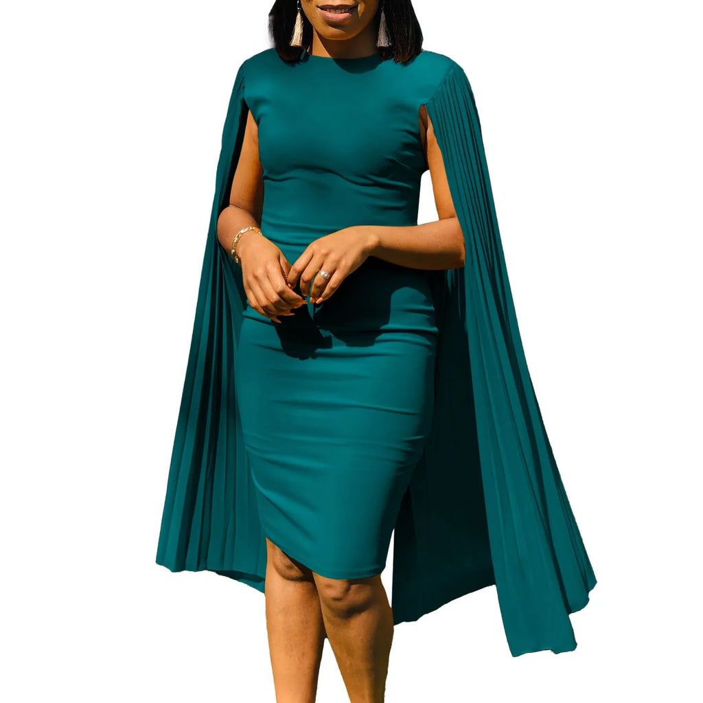 Yellow high-waisted evening gown with long sleeves and a pleated shawl detail at the neck.