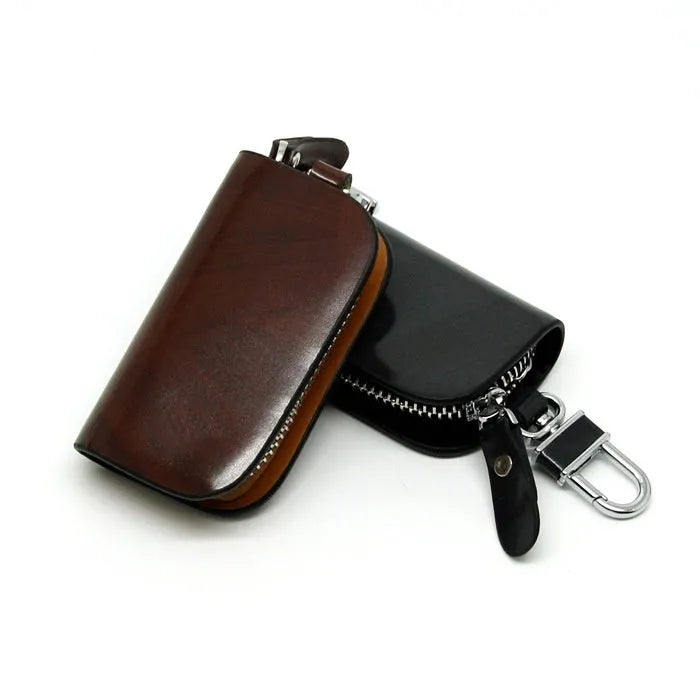 Genuine leather car key case in black or brown with frosted finish and 9.5cm by 4.5cm internal dimensions