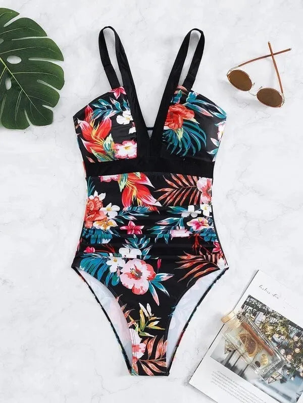 Women's floral print backless one-piece swimsuit on a hanger.