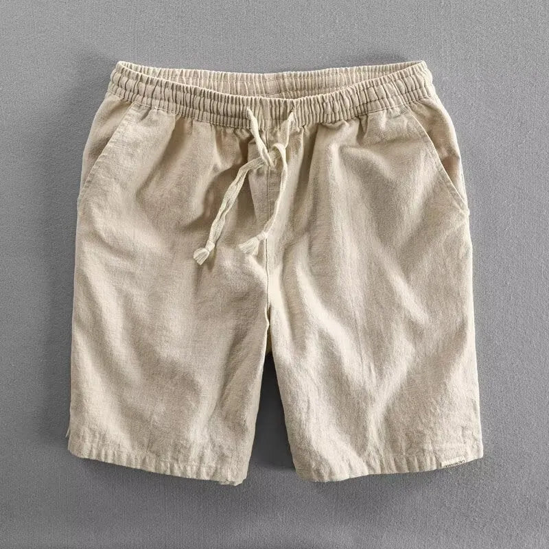 Man wearing loose-fitting cotton and linen casual shorts in a straight-leg style with an elasticated waist.