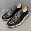 Men's handmade embossed pattern shoes in low tube design with front tie closure showing detail of pattern work