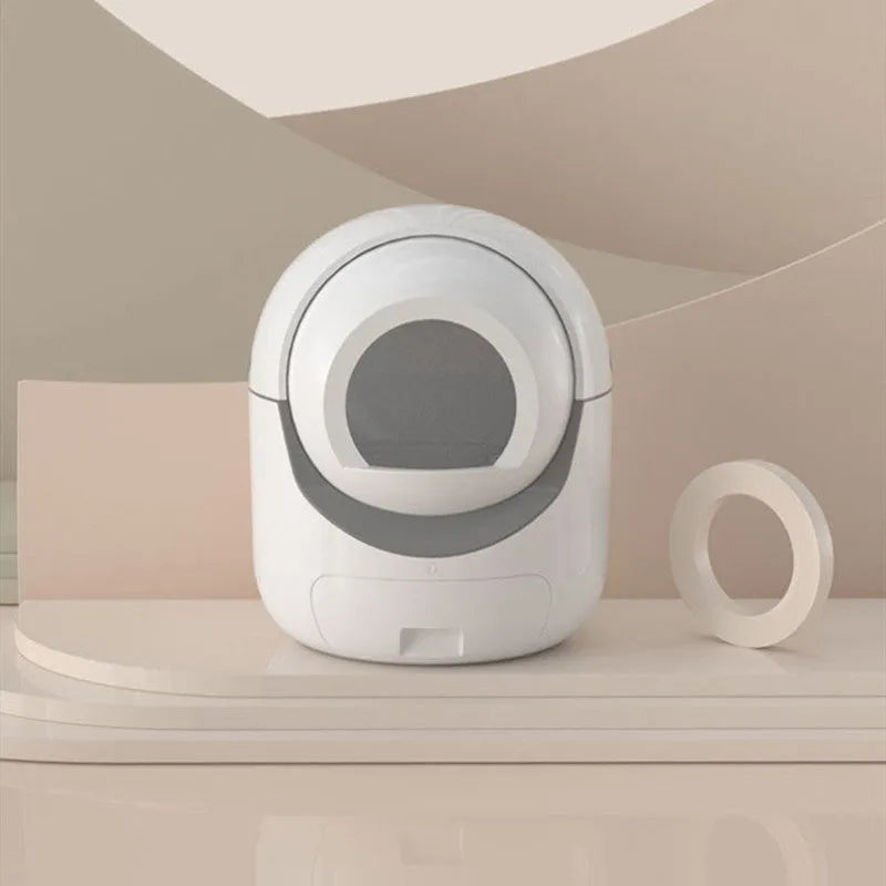 White fully automatic cat litter box with fully enclosed design, door curtain, and 220V US outlet option