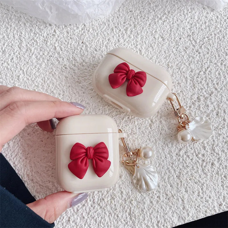 Beige red bow shell TPU AirPods case with clamshell design for AirPods Pro