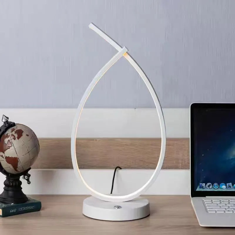 Black and white water drop shaped USB bedside table lamp measuring 30cm tall