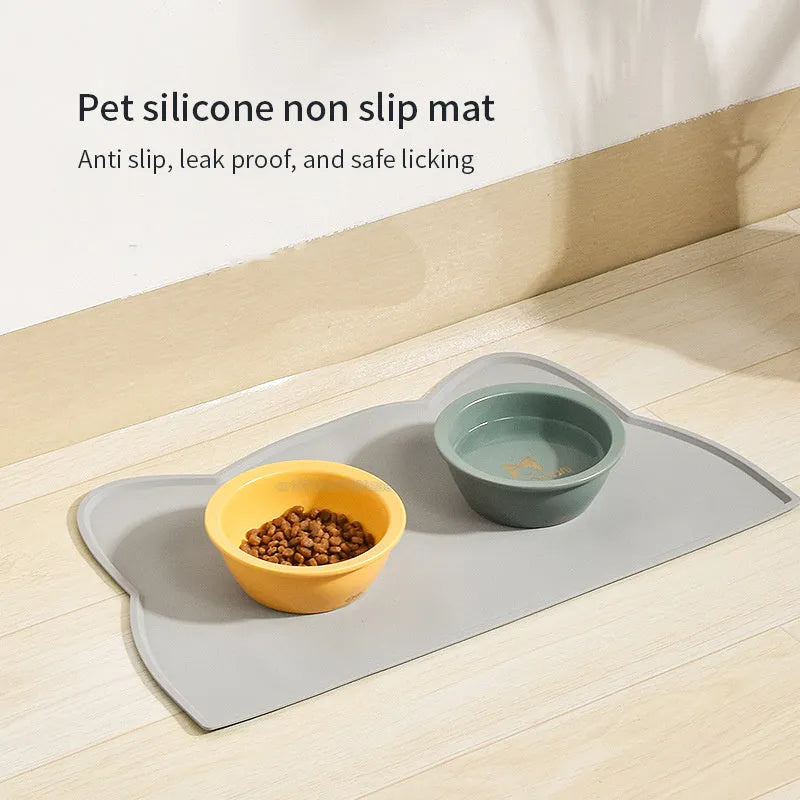 Blue silicone pet feeding mat with cat head design measuring 44cm by 24cm