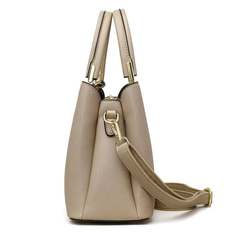 Women's black PU leather messenger bag with multi-layer shoulder strap and sewing thread detailing