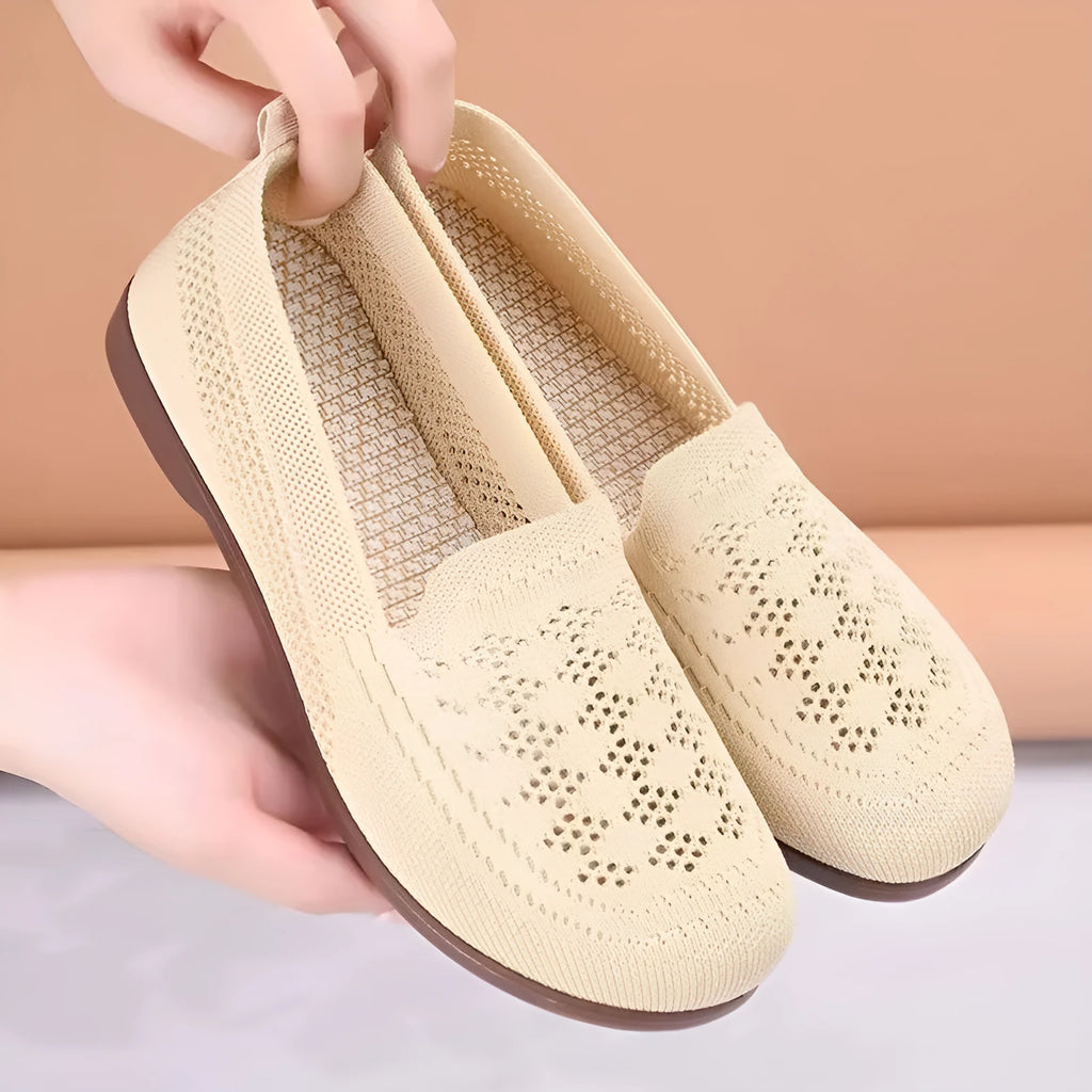 Beige women's low-top casual trainers with breathable Flyknit mesh and a flat antiskid PVC sole.