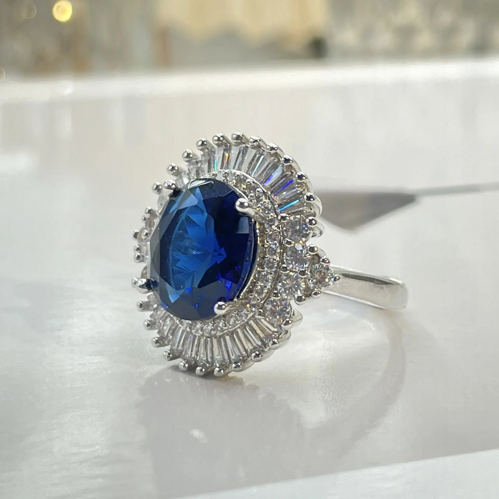 White gold colour copper crown shape ring with sea blue heart centrepiece and open mouth adjustable design
