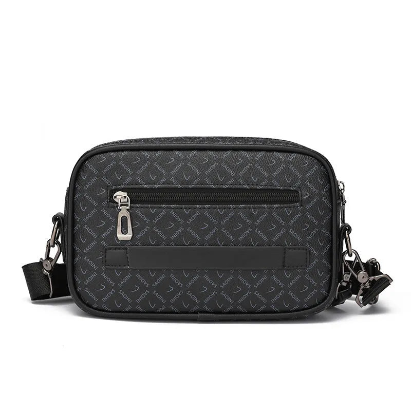 Men's black PU leather messenger bag with geometric pattern, showing horizontal shoulder carry design