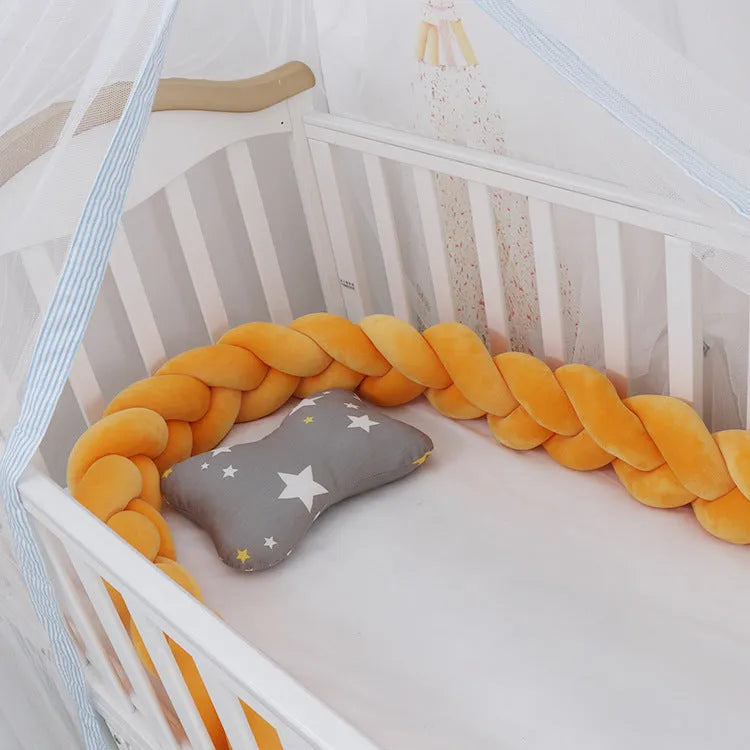 Baby crib bumper braid knot pillow cushion in spandex velvet fabric, shown in a multi-colour option.