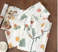 Traditional polyester maternity pajama set with turn-down collar, full bell sleeves, and ankle-length trousers in solid natural colour