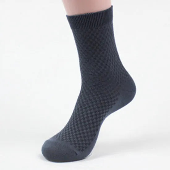 Men's bamboo fibre socks in a small square pattern, shown in neutral colours including grey and navy.