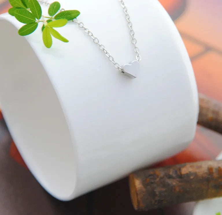 Heart & Soul choker necklace with gold plated heart-shaped alloy pendant on simple chain