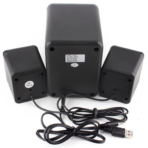 Green 2.1 USB mini computer speaker with colourful LED glowing lights on a desk.