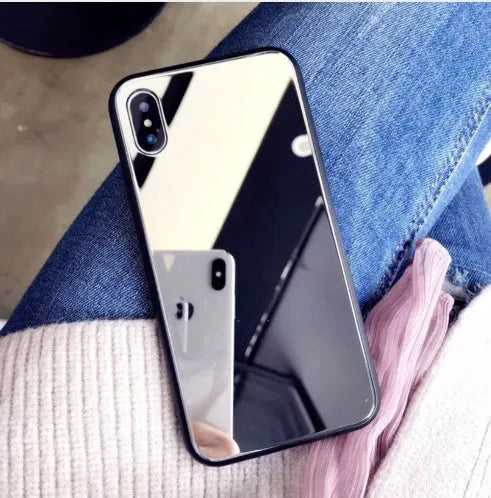 Black iPhone mirror phone case showing reflective surface, compatible with iPhone X and 7/8 Plus models.