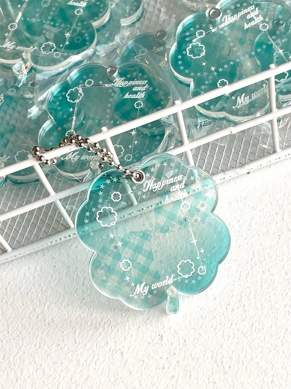 Acrylic four-leaf clover mobile phone pendant charm in blue, green, or mint colour options