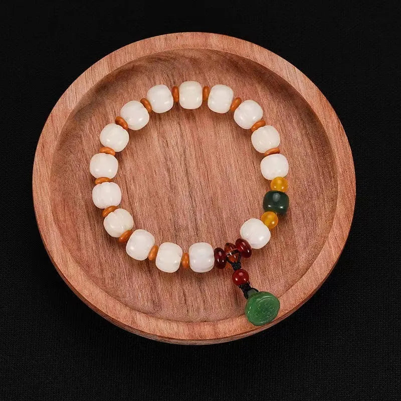 Hand-carved pumpkin lotus beads bracelet in white jade and bodhi root with multiple bead sizes