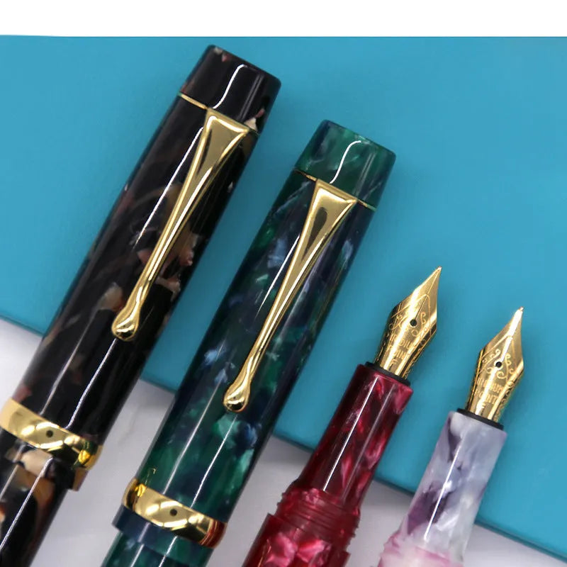 Acrylic fountain pen in multiple colours including black, blue, green, pink, and red