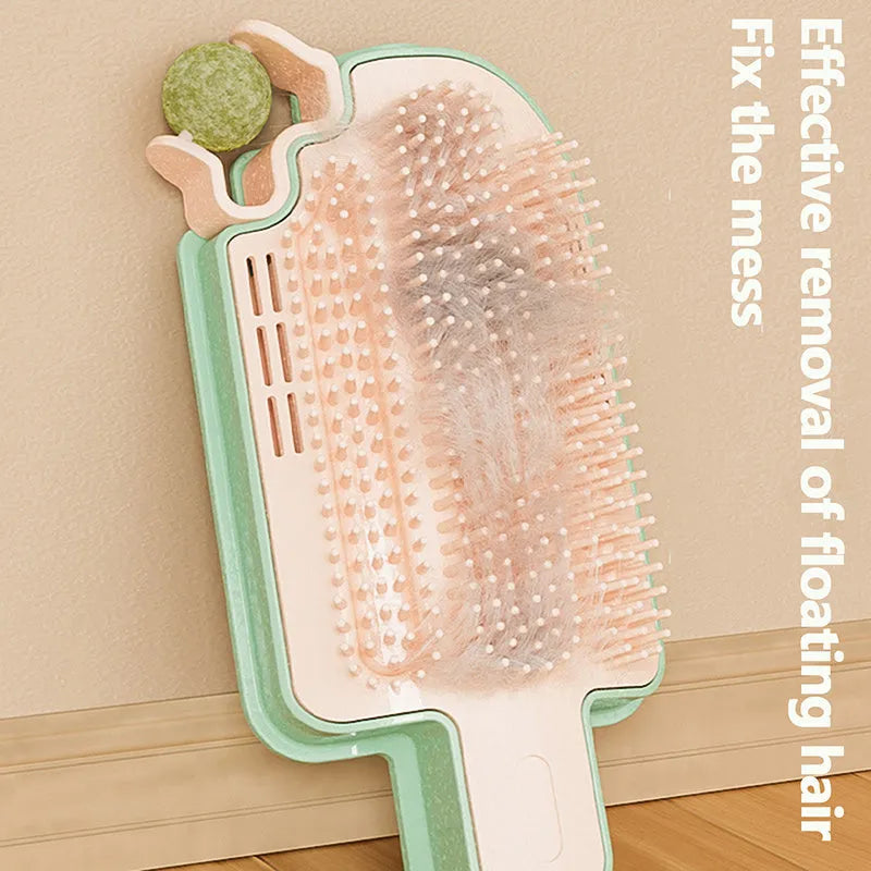 Ice cream shape cat corner scratcher with mint ball and feather attachments on a white background