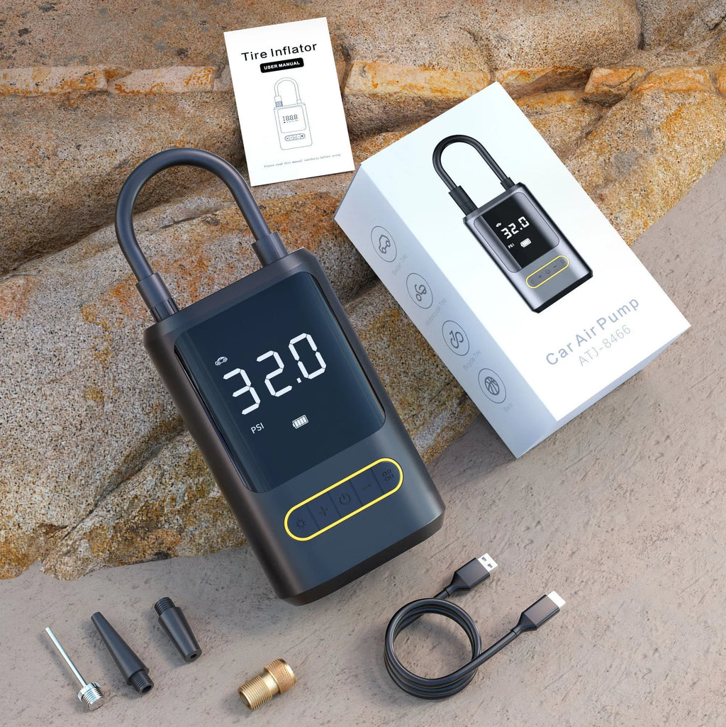 Handheld wireless car air pump with digital display showing pressure reading, includes air hose and multiple nozzle attachments