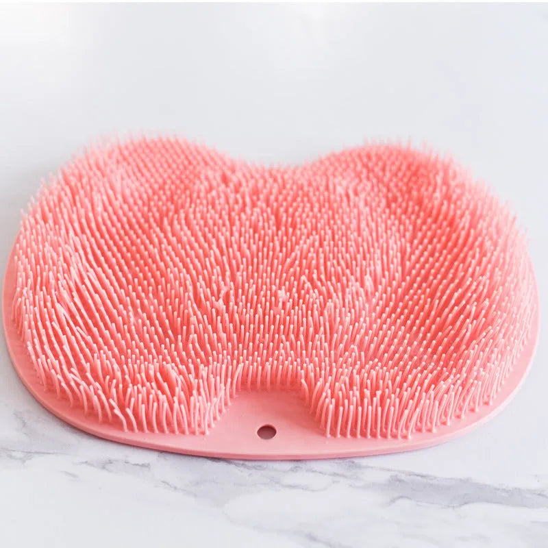 Orange non-slip TPR bath mat with silicone bristles for foot massage and cleaning.
