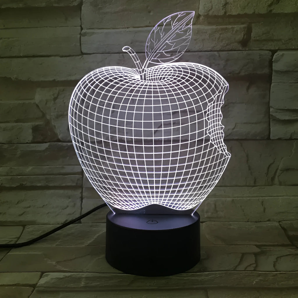 3D acrylic fruit-shaped night light with touch control and multi-colour LED illumination on a dark surface.