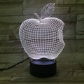 3D acrylic fruit-shaped night light with touch control and multi-colour LED illumination on a dark surface.