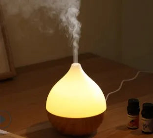 Asakusa wood grain vase-shaped aroma diffuser with USB cable on a wooden surface.