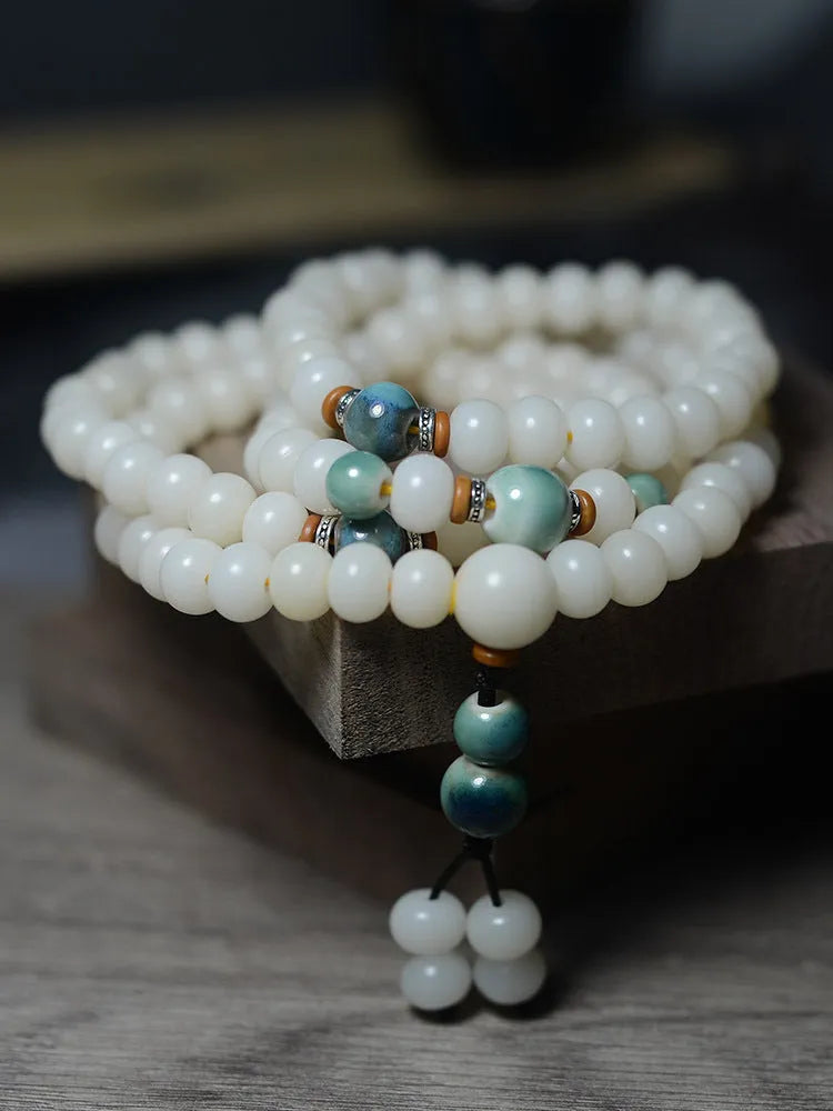 White jade bodhi seed bracelet with 108 flat round beads in 7x9mm and 8x10mm sizes