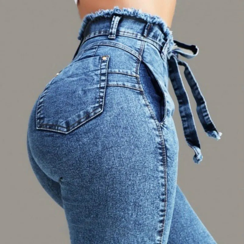 Men's dark blue fringed jeans with distressed frayed hemline detailing