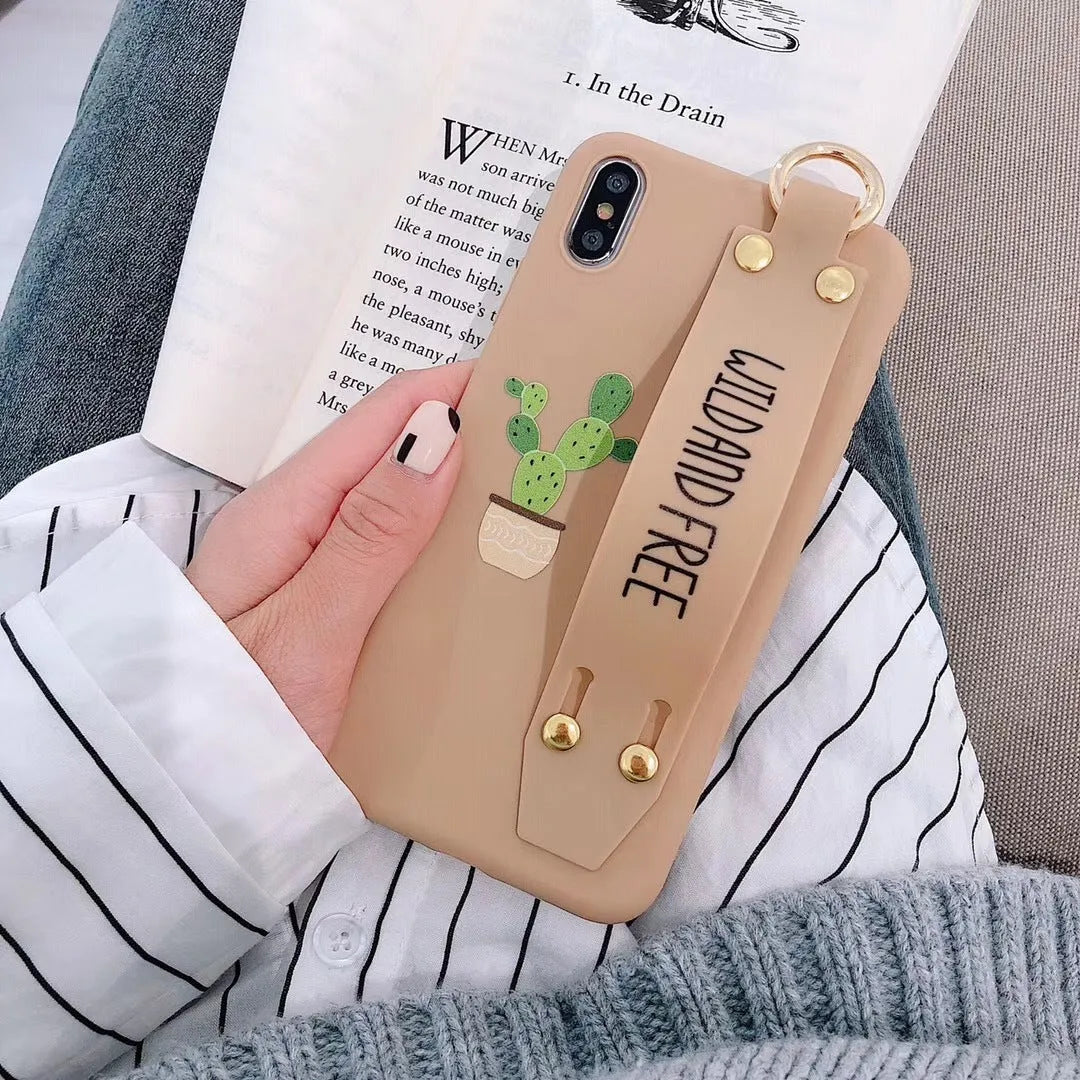 Green iPhone case with a detachable wristband and graffiti print on the back.