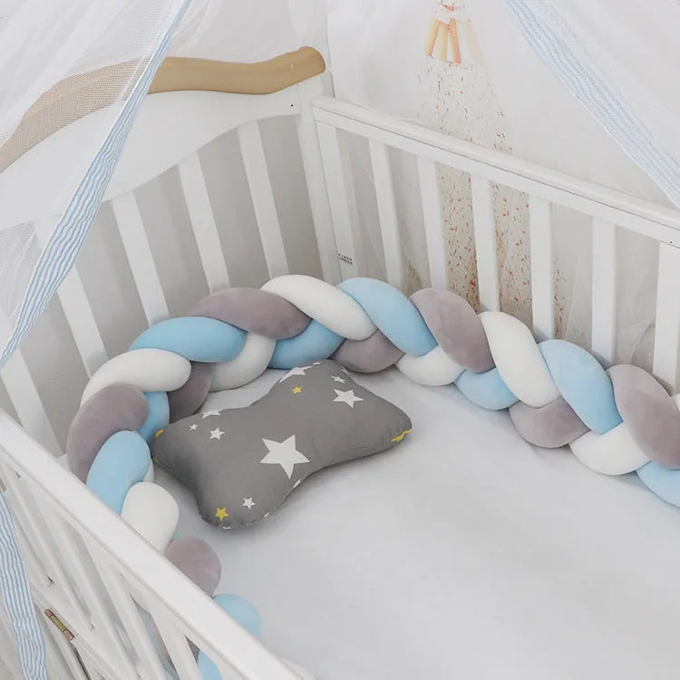 Baby crib bumper braid knot pillow cushion in spandex velvet fabric, shown in a multi-colour option.