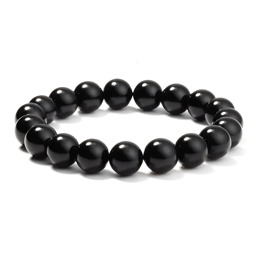 Geometric black onyx bracelet with 8mm agate beads on a black elastic cord.