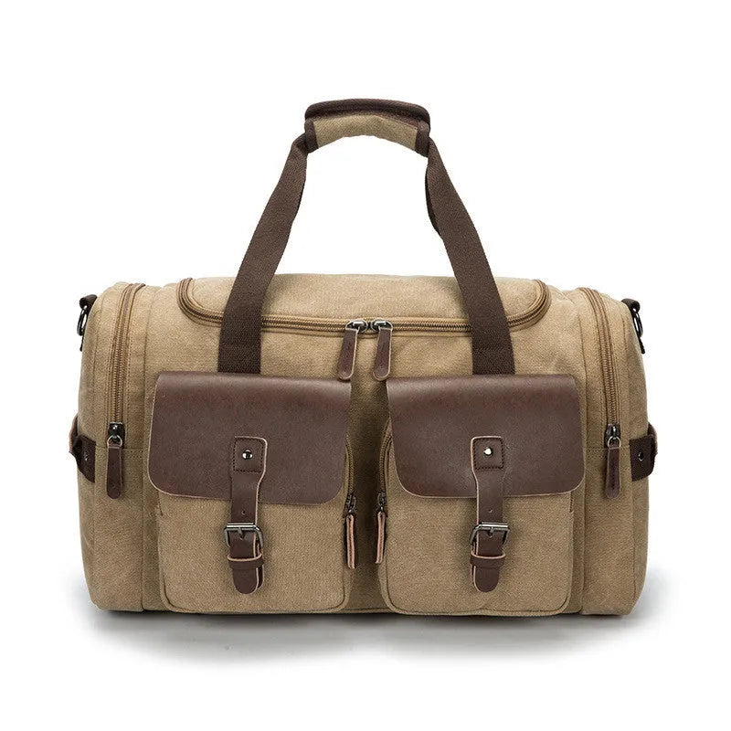 Medium canvas travel bag with zip opening, double straps, soft handle, and backpack shoulder pad in black, blue, grey, or khaki