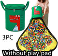 Green felt cube storage bag with a pull rope, shown unfolded as a flat play mat for toys.