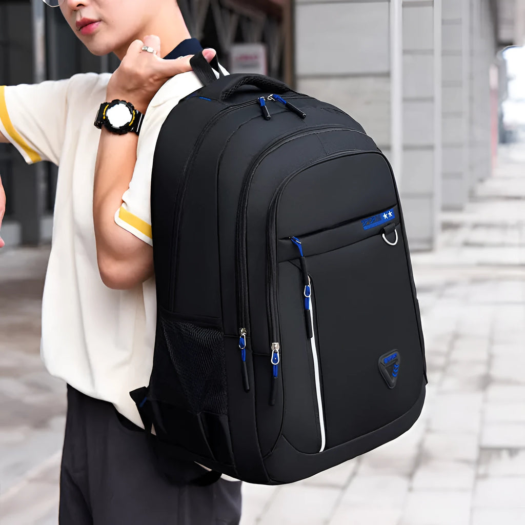 Men's large Oxford cloth schoolbag in red with letter pattern and burden reduction straps.