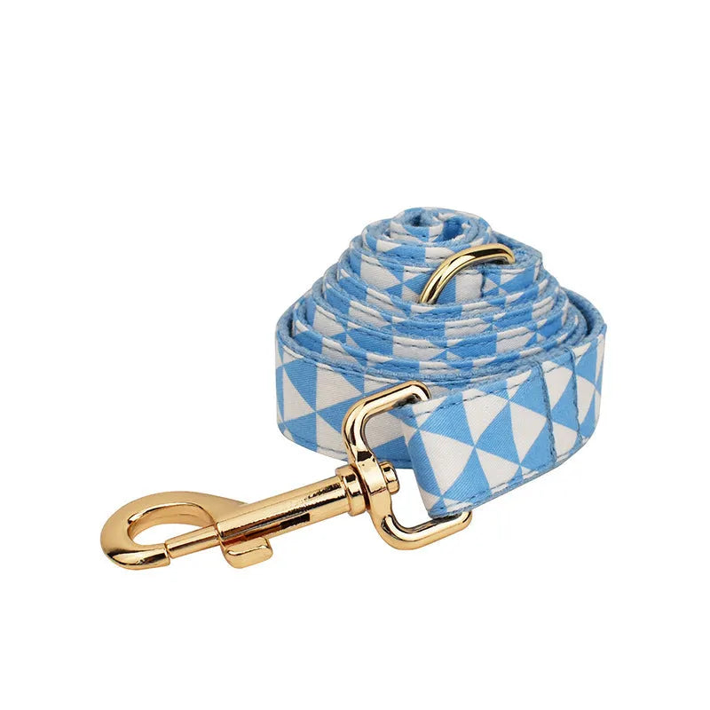 Blue four-piece dog set with collar, leash, bow, and vest in cloth material