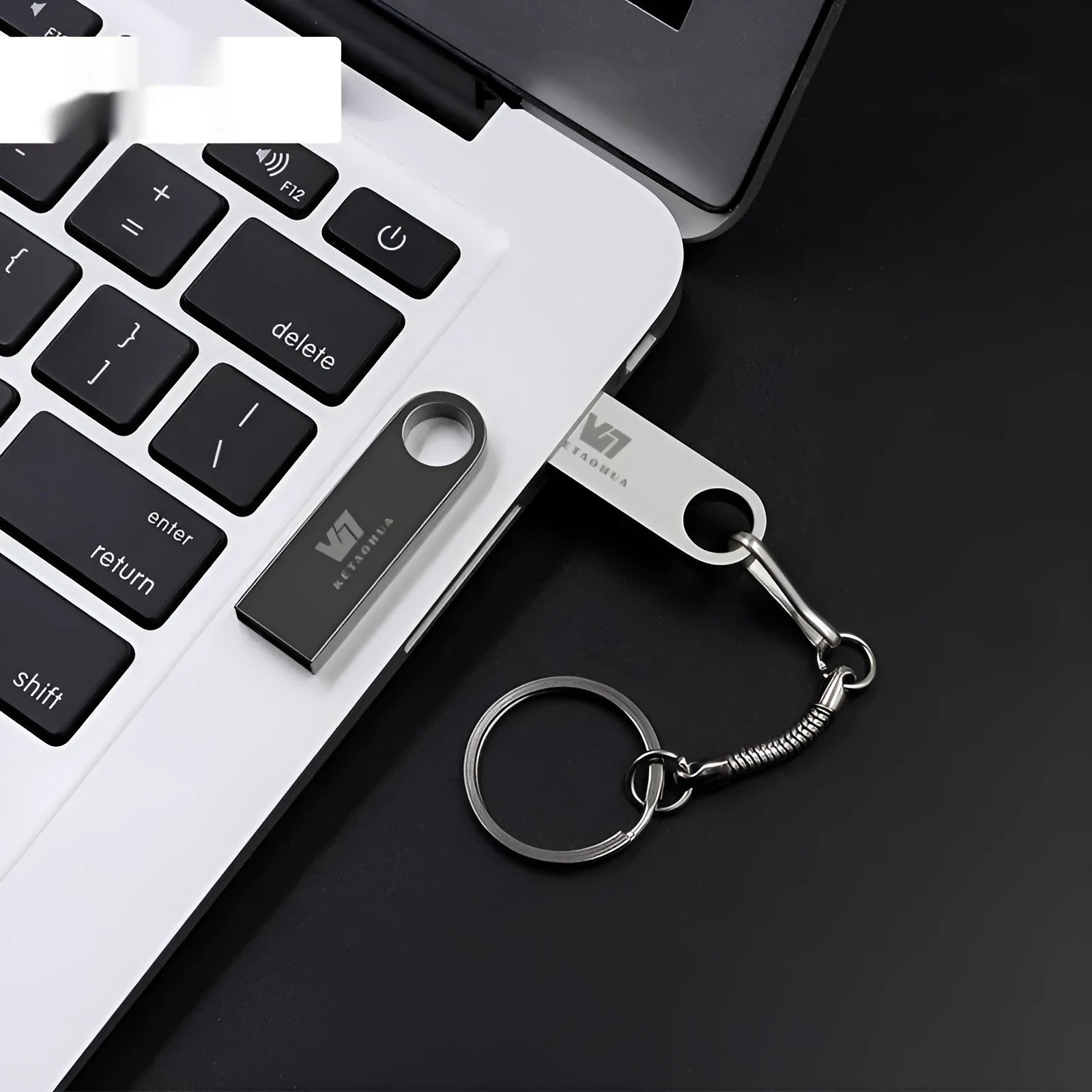 Metal car-shaped USB flash drive in silver finish showing detailed automotive design and USB connector