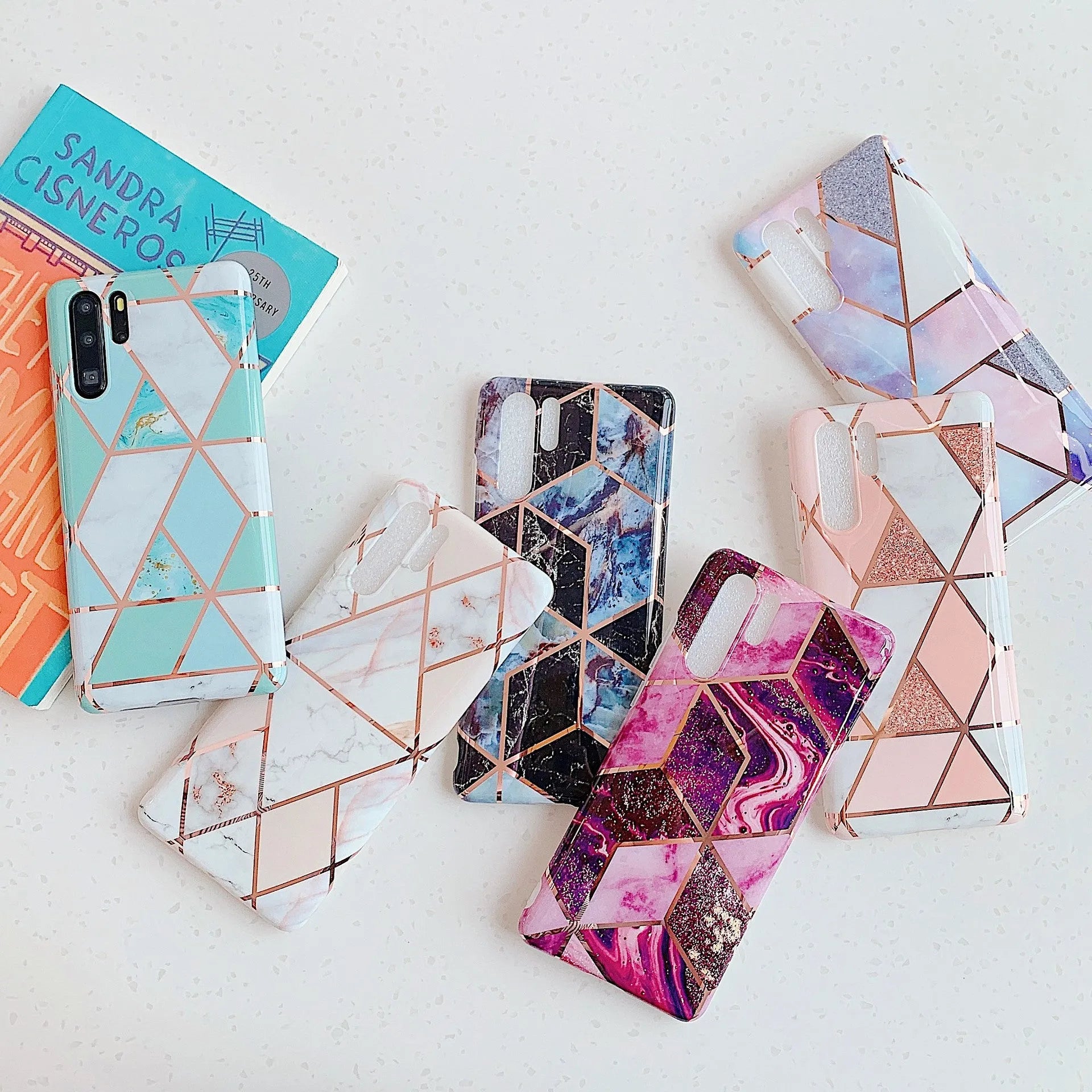 Electroplated marble finish mobile phone case for Huawei and Samsung smartphones in various colours.