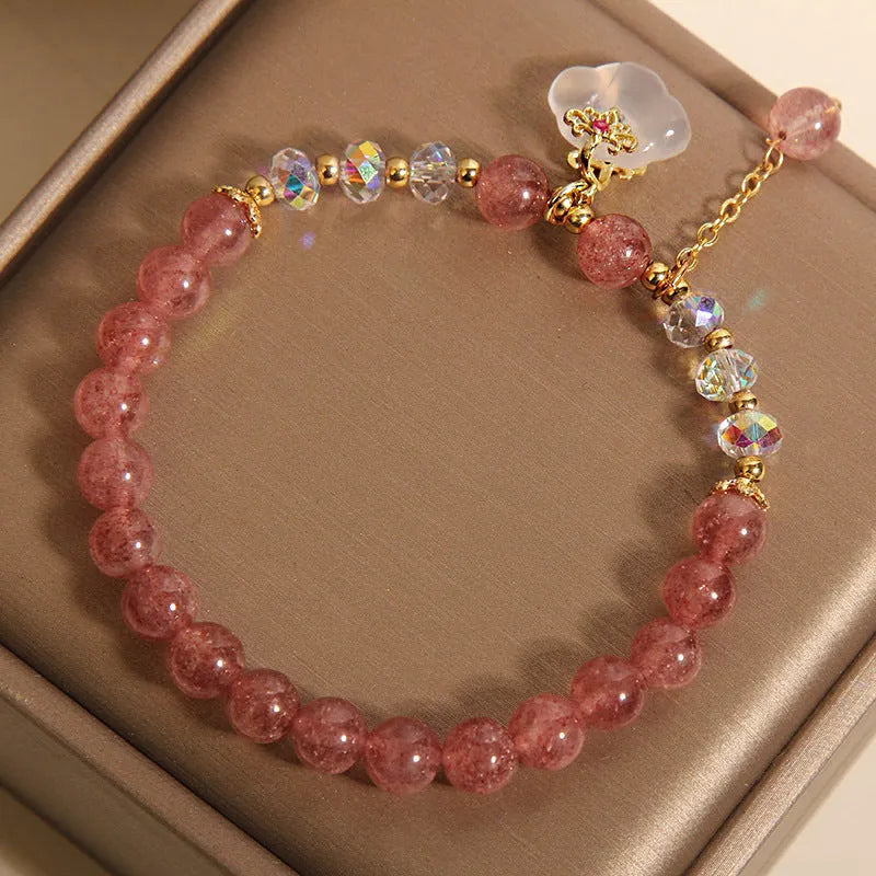 Women's natural crystal bracelet with strawberry quartz and white agate beads featuring auspicious cloud design