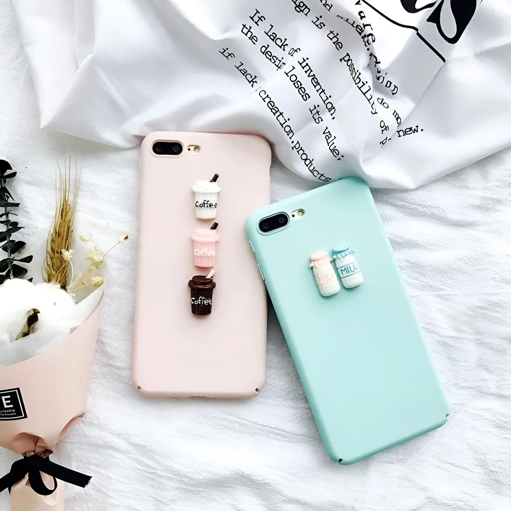 Soft pink silicone TPU phone case with a raised 3D cartoon cat design on the back, fitted to an iPhone.