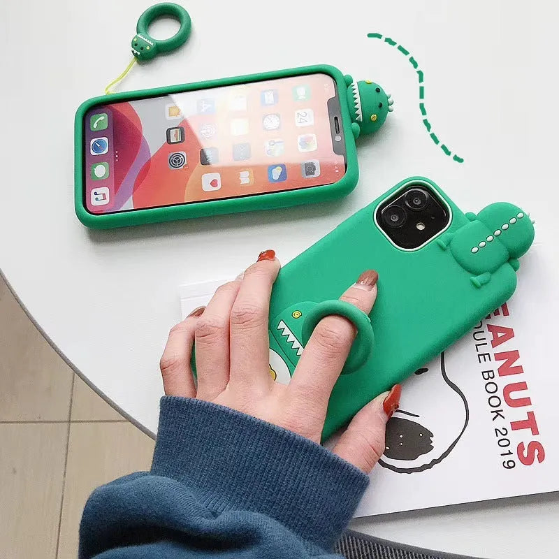 Green silicone iPhone case with a cartoon animal design on the back