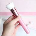 Cat paw brush with fibre bristles, birch wood handle, and aluminium tube in black colour option