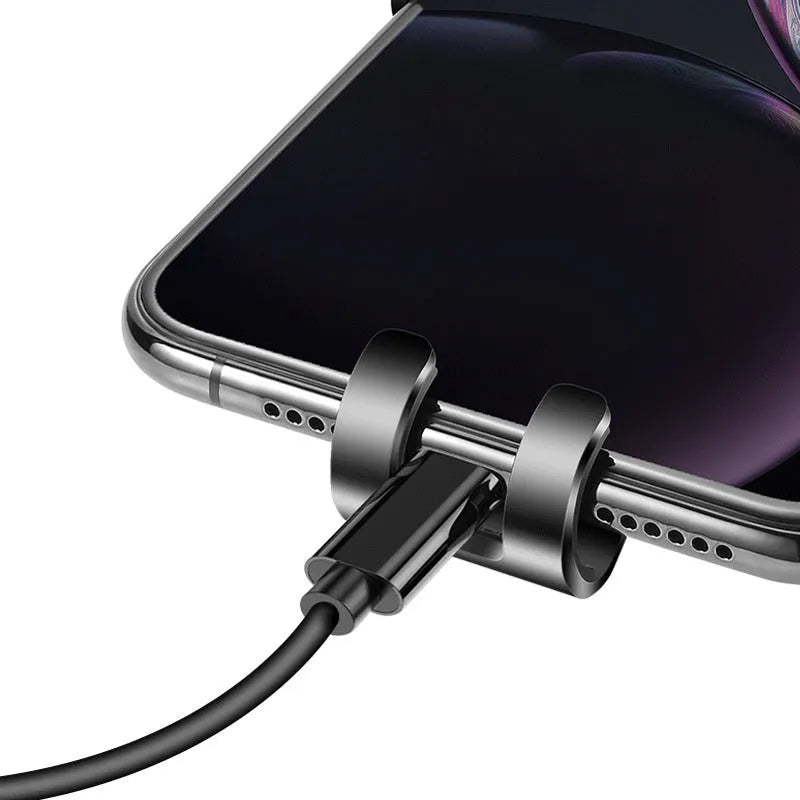 Black S4 gravity mirror ABS car phone mount attached to vehicle air conditioning vent holding smartphone