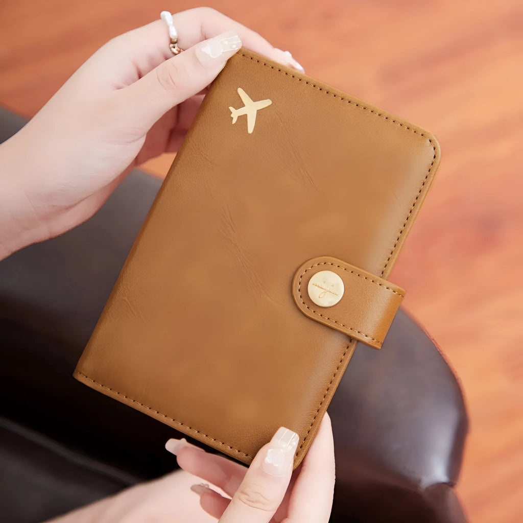 Women's PU passport holder with aircraft pattern design in multiple colour options showing organised document storage compartments