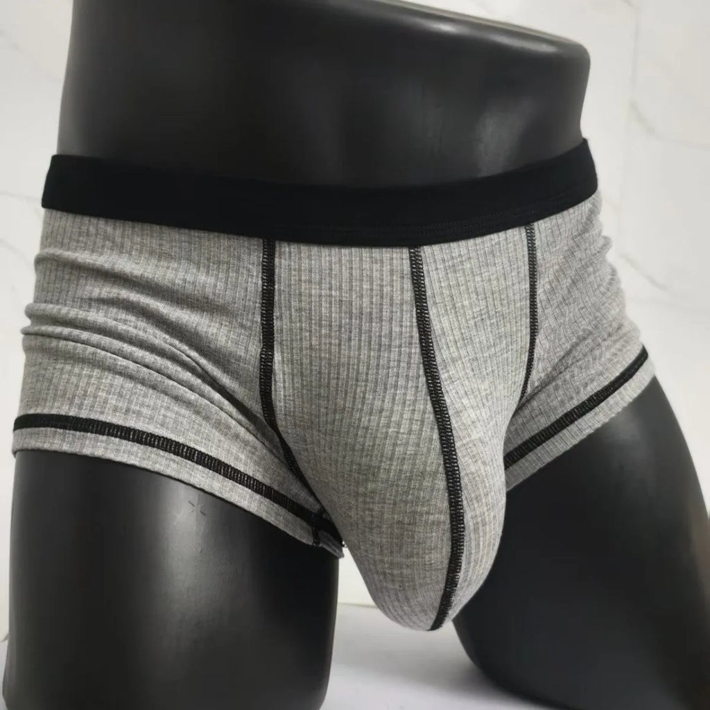 Men's solid colour breathable boxer shorts on a size chart showing weight ranges for L, XL, 2XL, and 3XL.