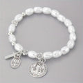 Silver beaded flower bracelet on display with metal links