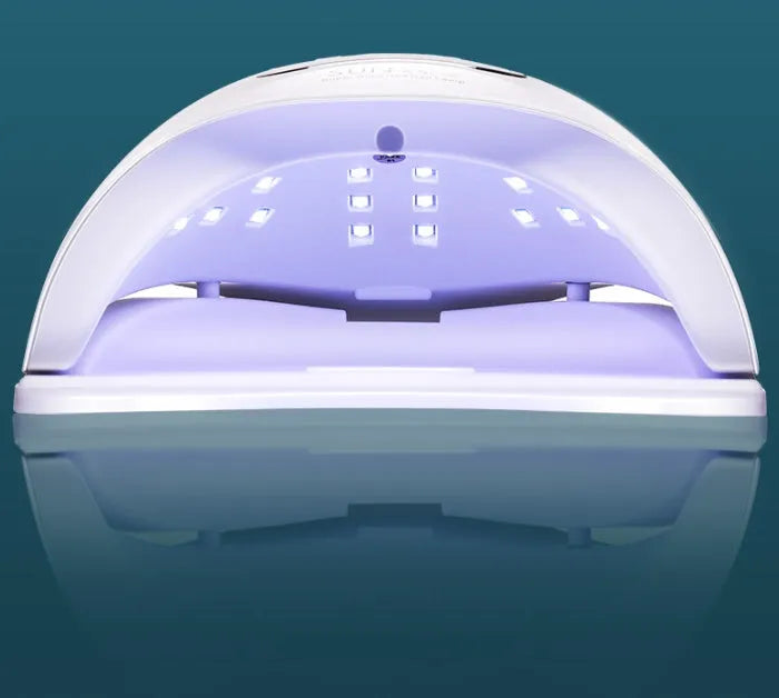White nail polish drying lamp with dual UV LED light sources and multiple timer buttons