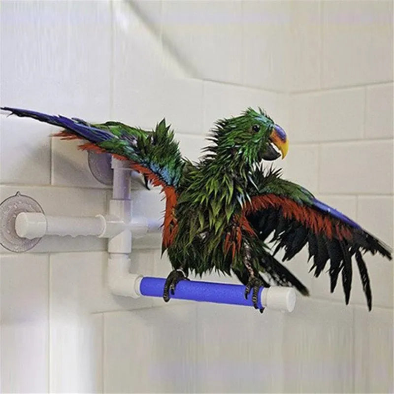 White plastic parrot bath shower stand with three suction cups folded flat on table showing 22x18x24cm dimensions