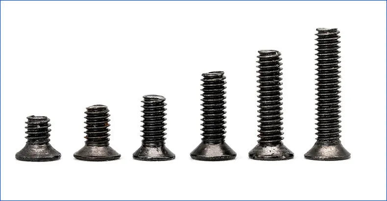 Box of small black countersunk head machine screws for laptop and electronics repair.